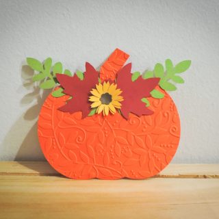 small pumpkin with sunflower